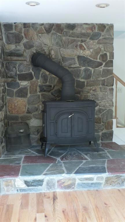 FIELDSTONE HEARTH AND WOODSTOVE