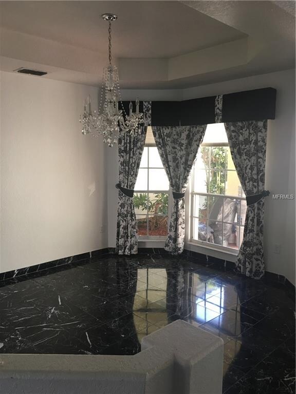 Formal Dining Room with Marble tile, trey ceiling 