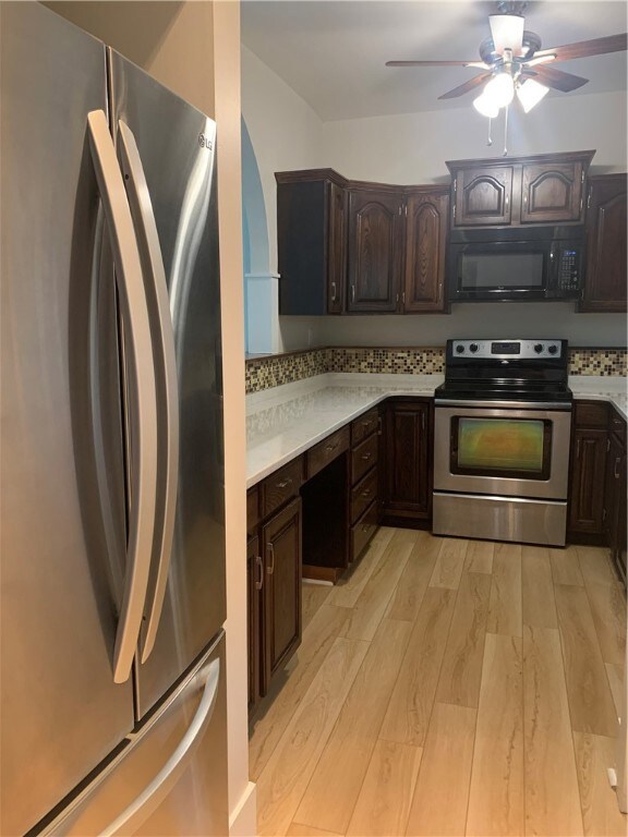 Entry to the kitchen. Stainless steel Refrigerator