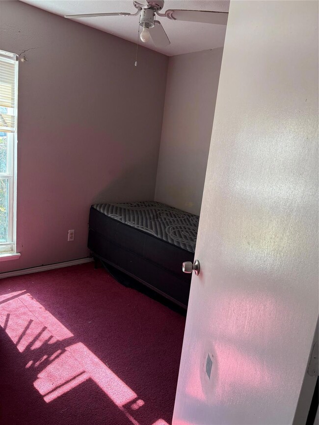 Bedroom featuring carpet and ceiling fan