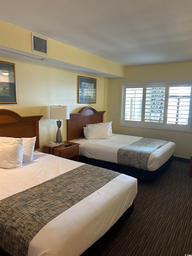 Bedroom featuring multiple windows