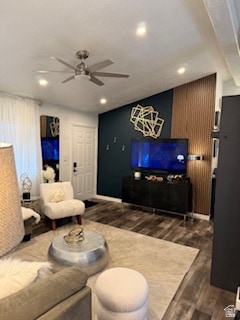 Living area featuring dark wood-style flooring, a ceiling fan, and recessed lighting