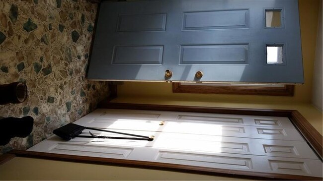 Entryway with closet for storage.
