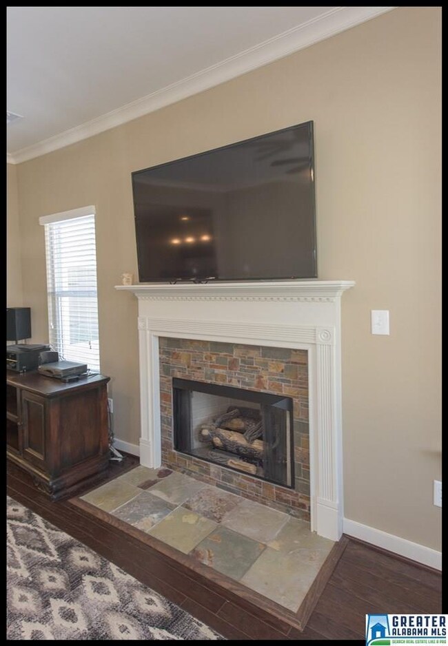 Gas fireplace with stone in the great room.