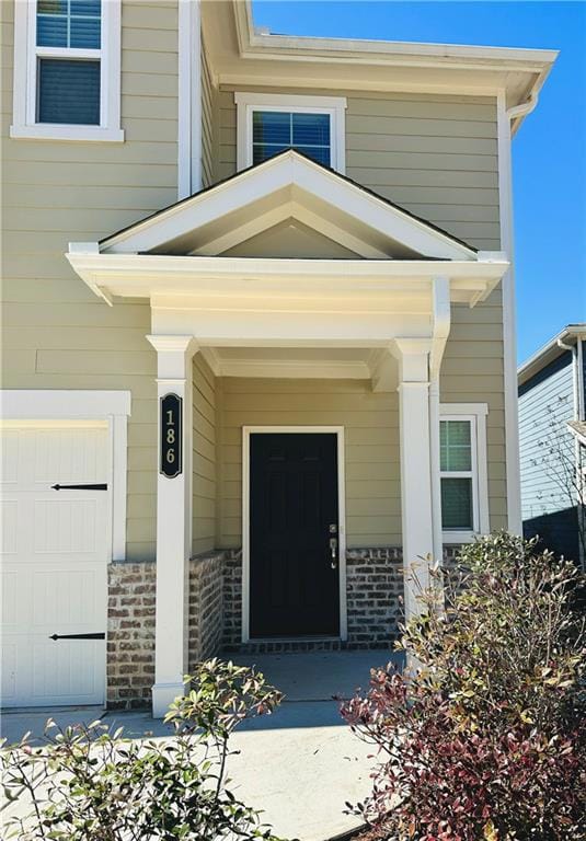 Entrance to property with brick siding