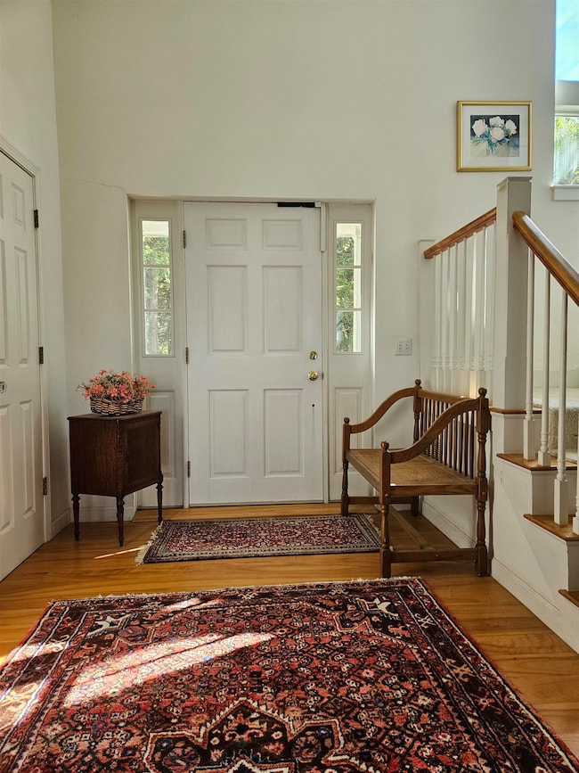 Elegant front foyer with cathedral ceiling