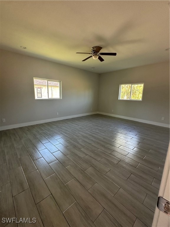 Spare room with a wealth of natural light, hardwoo
