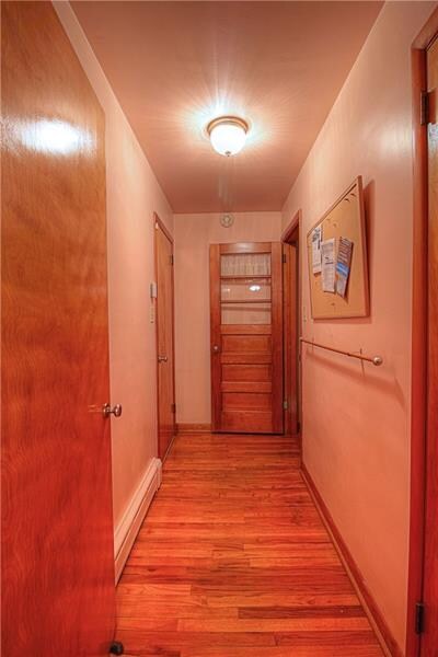 This hallway is also graced with hardwood flooring