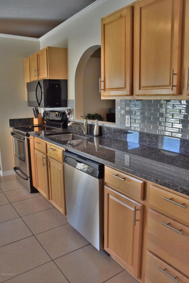 Solid Wood Cabinets and Stainless Applia