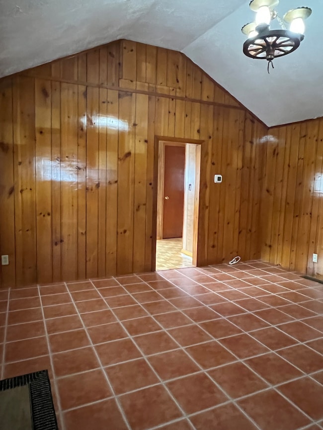 Living room leads to cozy bedroom.