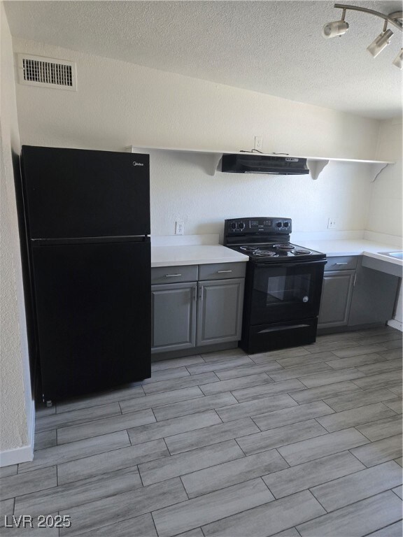 Kitchen with refrigerator, range, open shelves, gr