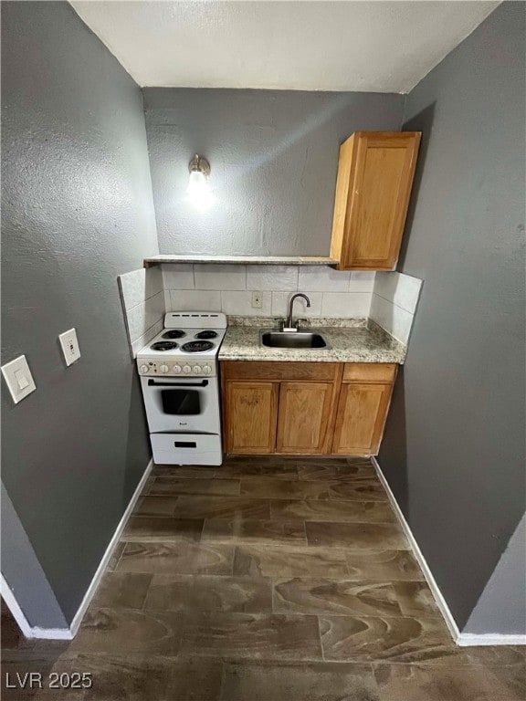 Kitchen with white range with electric cooktop, a