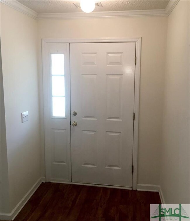 Wood flooring at entrance foyer.