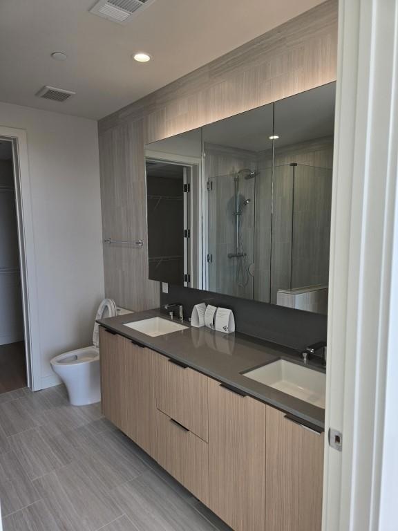 Full bath featuring visible vents, a sink, and a 