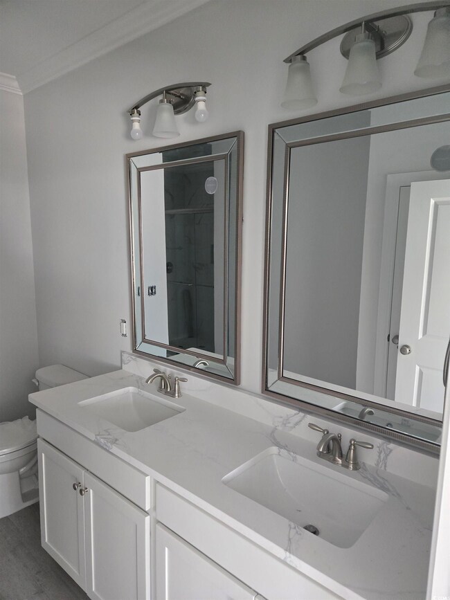 Bathroom featuring hardwood / wood-style floors, v