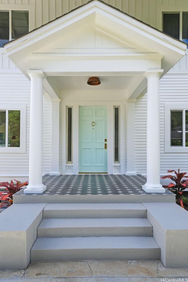 Imagine being welcomed home each day through a cheerful mint front door, stepping across timeless black-and-white concrete flower pavers that whisper both charm and sophistication.
