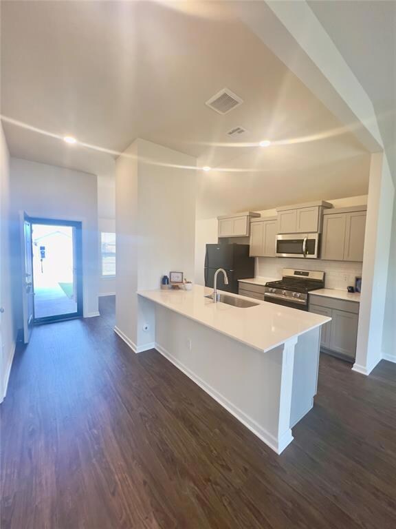 Kitchen featuring sink, stainless steel appliances