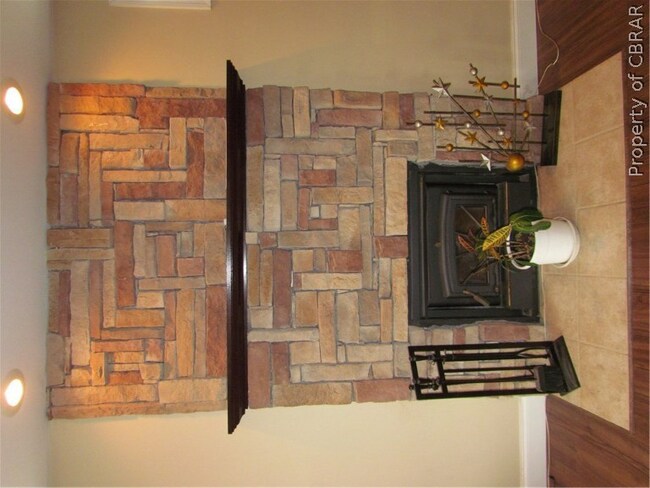Wood-Burning Fireplace has insert with blower.