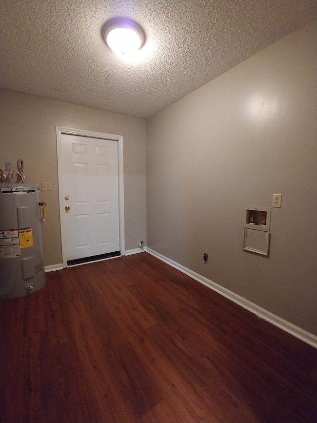 Laundry room with door to back yard