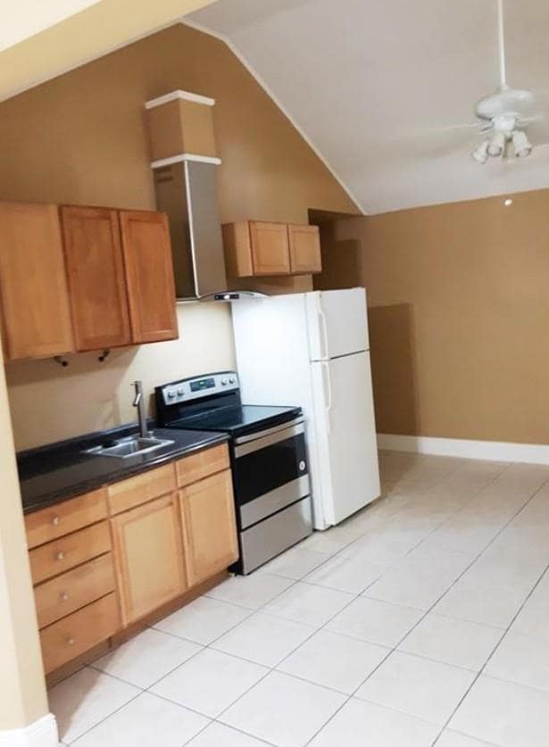 Kitchen with stainless steel range with electric 