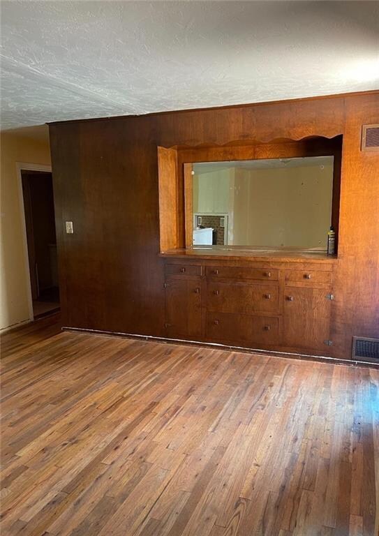 Formal dining room with  built  in buffet, beautiful hard wood floors.