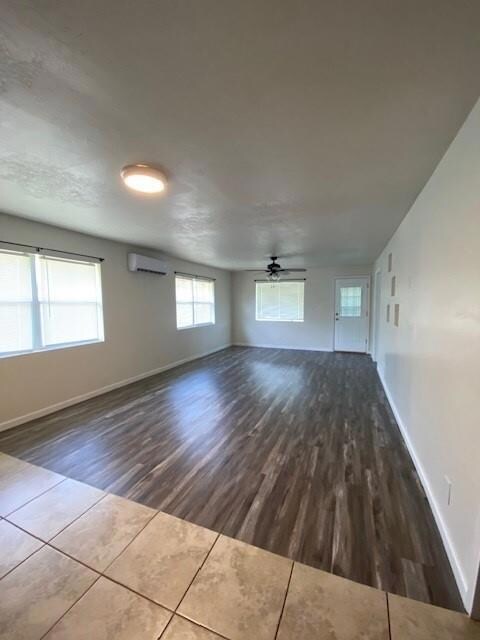 Living room with wood finished floors and ceiling fan