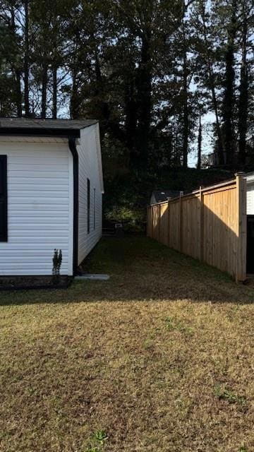 View of yard featuring fence