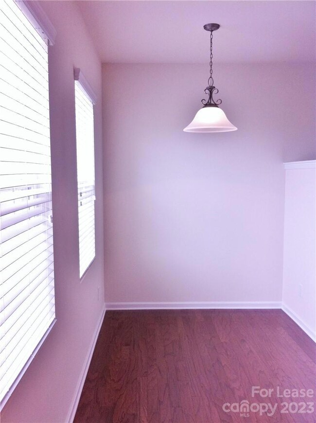 Cozy breakfast nook shares space with the kitchen.