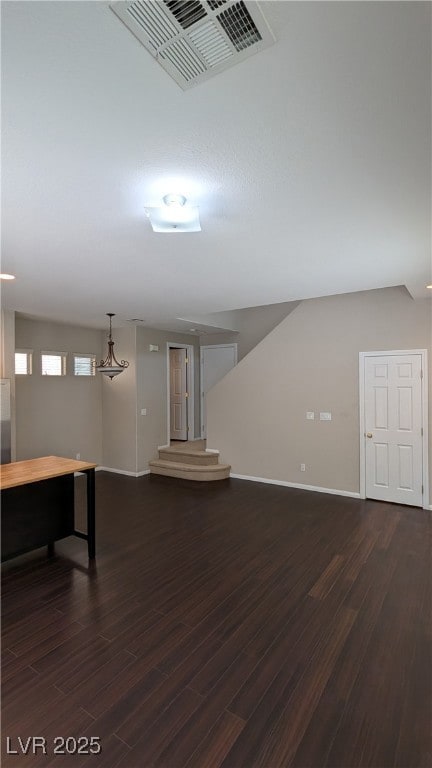 Below grade area featuring dark wood-style floorin