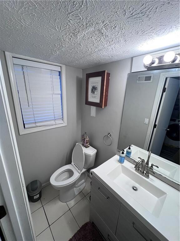 Bathroom featuring tile patterned floors, vanity, 