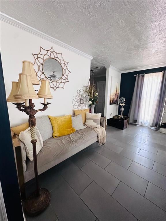 Living area featuring ornamental molding, a textured ceiling, tile patterned floors, and ceiling fan