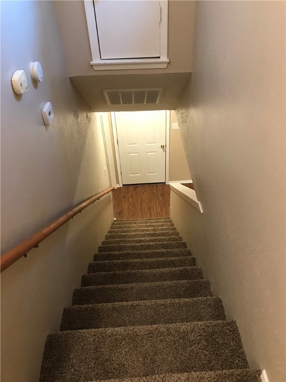 Staircase with wood finished floors