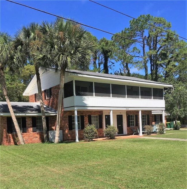 View from corner of Ogden and Forrest of side B which has a carport and private driveway.