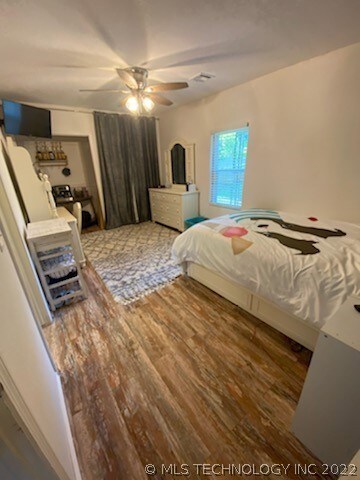 Bedroom 2 (1st level) with semi-private bath.