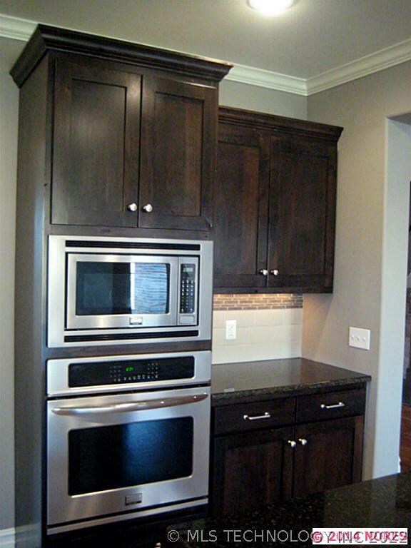 Storage galore in kitchen with under-mount lightin