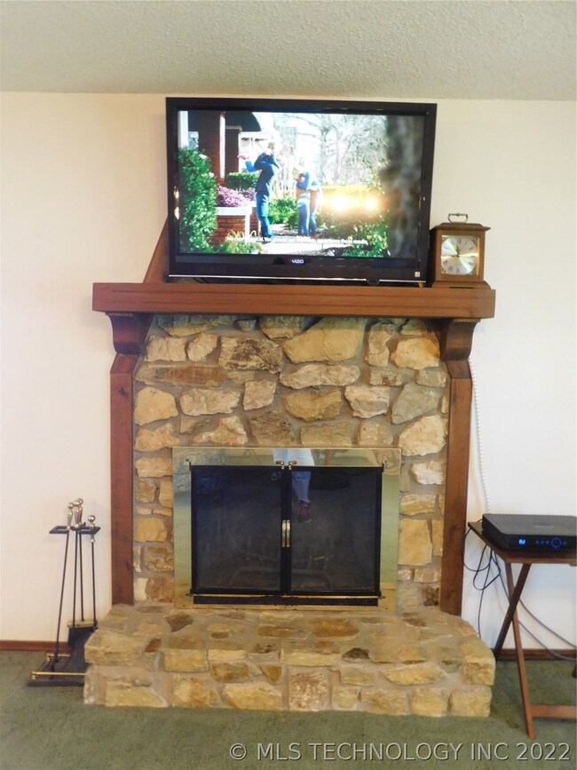 Fireplace tools stay with property.