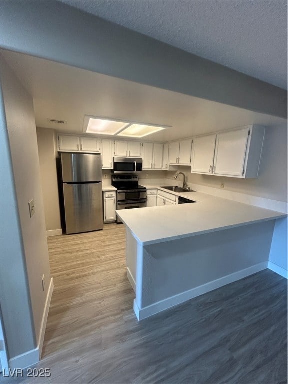 Kitchen with fridge, baseboards, range with electr