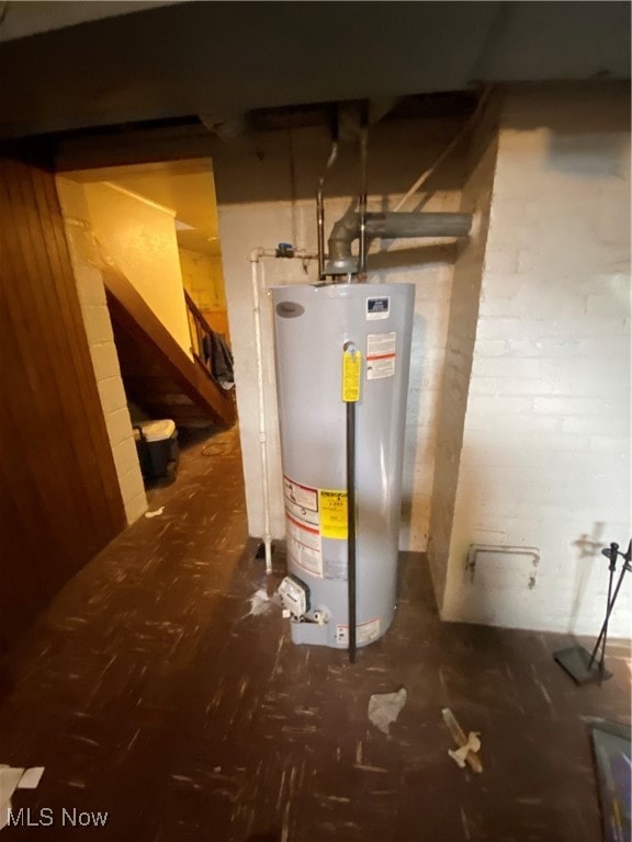Utility room featuring water heater