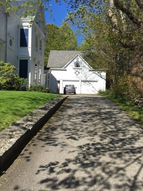 Paved driveway to side entrance and...