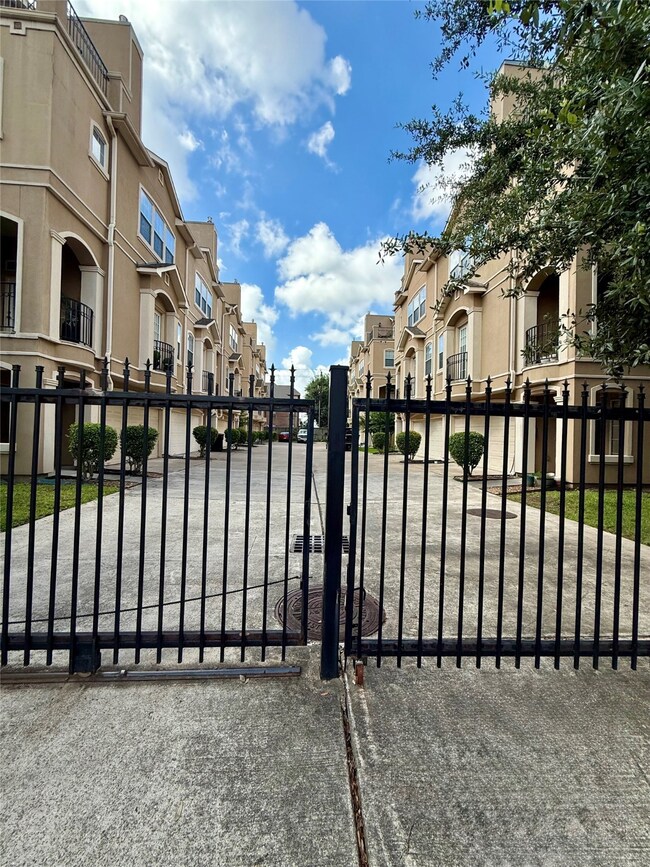 This is a three-story townhouse with a beige exter