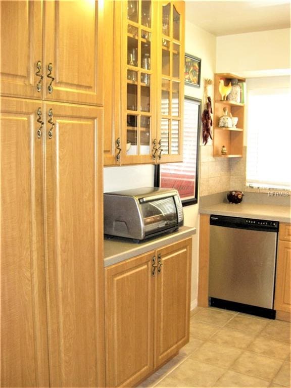 Window-front cabinets add to the kitchen's airy fe