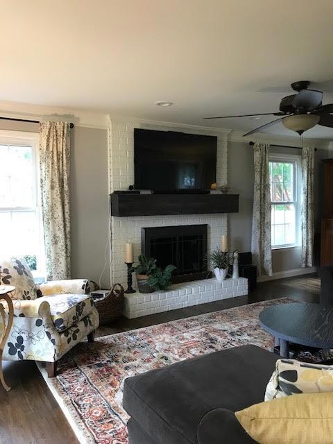 Living Room with beautiful fireplace - freshly painted and filled with lots of light