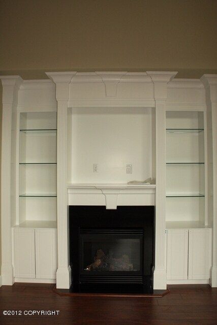 Fireplace with built-in shelves