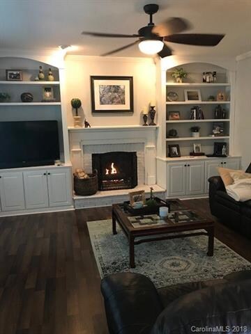 Family room with laminate hardwood floors and a ga