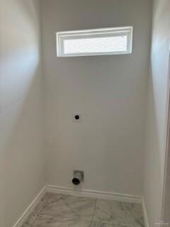 Clothes washing area featuring electric dryer hookup and tile floors