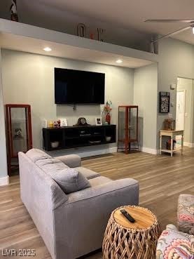 Living area featuring light wood-style flooring and baseboards