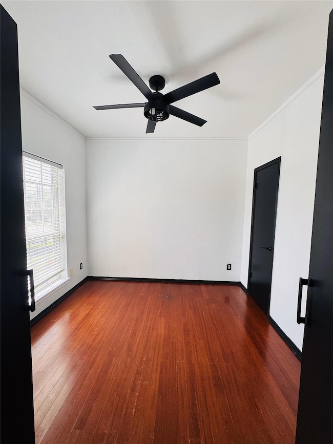 Bedroom 2 with wood-type flooring, baseboards, orn
