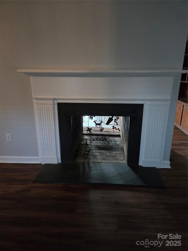 Fireplace, living room and den. Open on both sides.