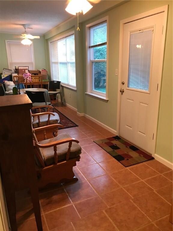 Sun porch has tile floors & can be accessed from t