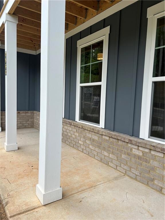 Front of home with large covered porch.